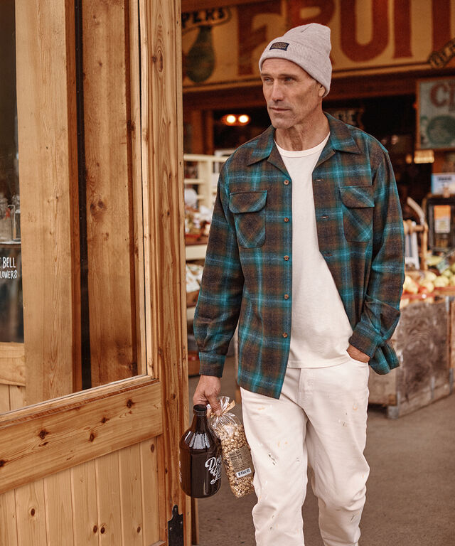 Man outside wearing a Pendleton Plaid Board Shirt